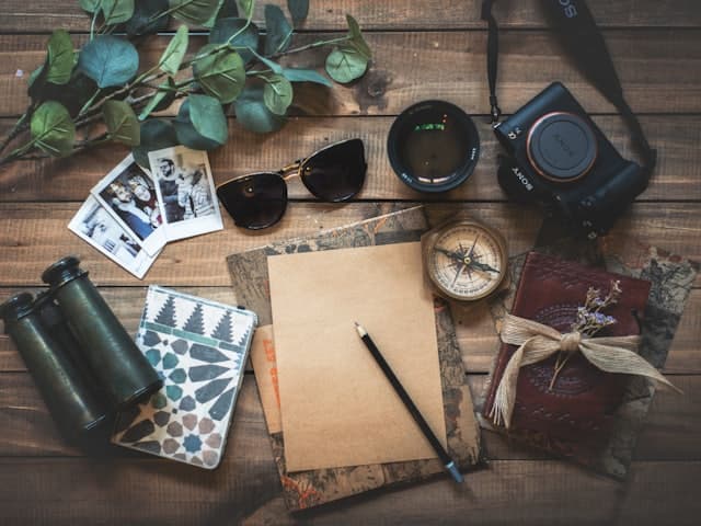 Travel flat lay on a wooden table